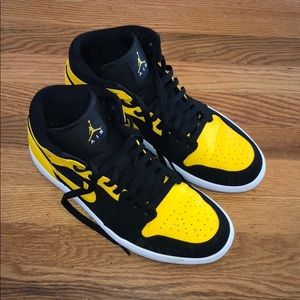 Black and yellow Jordan 1s